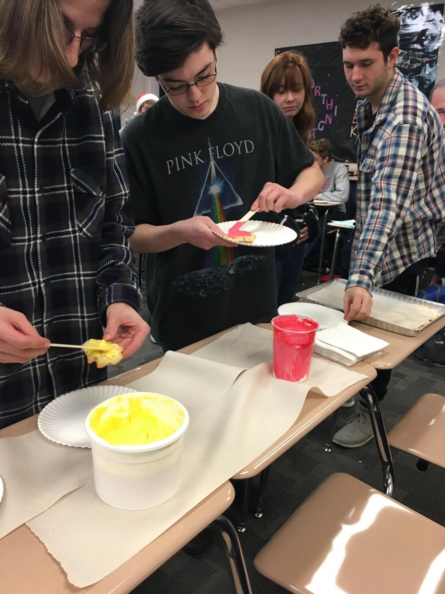 people decorating cookies